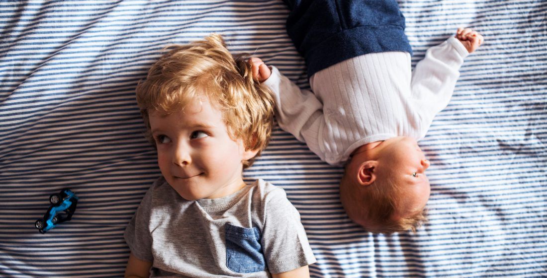 Small boy with a newborn baby- Prepare Your Child for a New Sibling