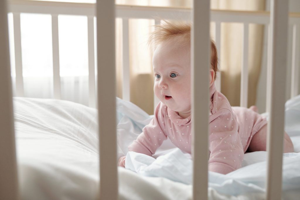 baby girl- white bed- baby sleeping- wake up newborn baby