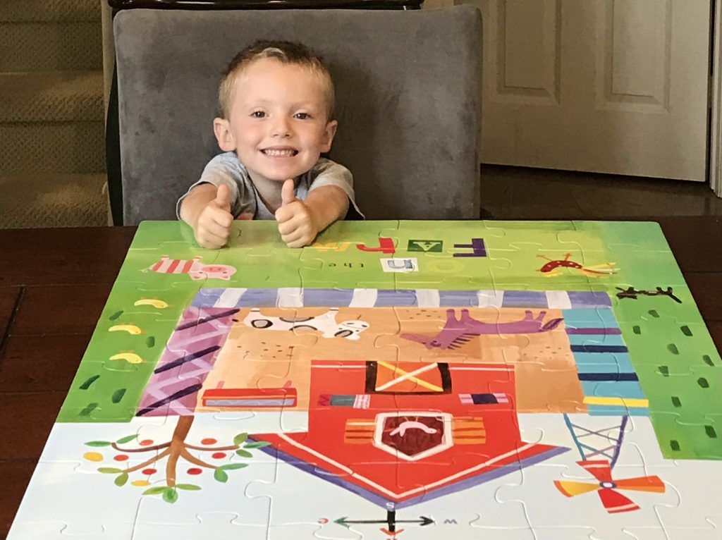 The boy is playing puzzles at daycare center_ Educational Toys