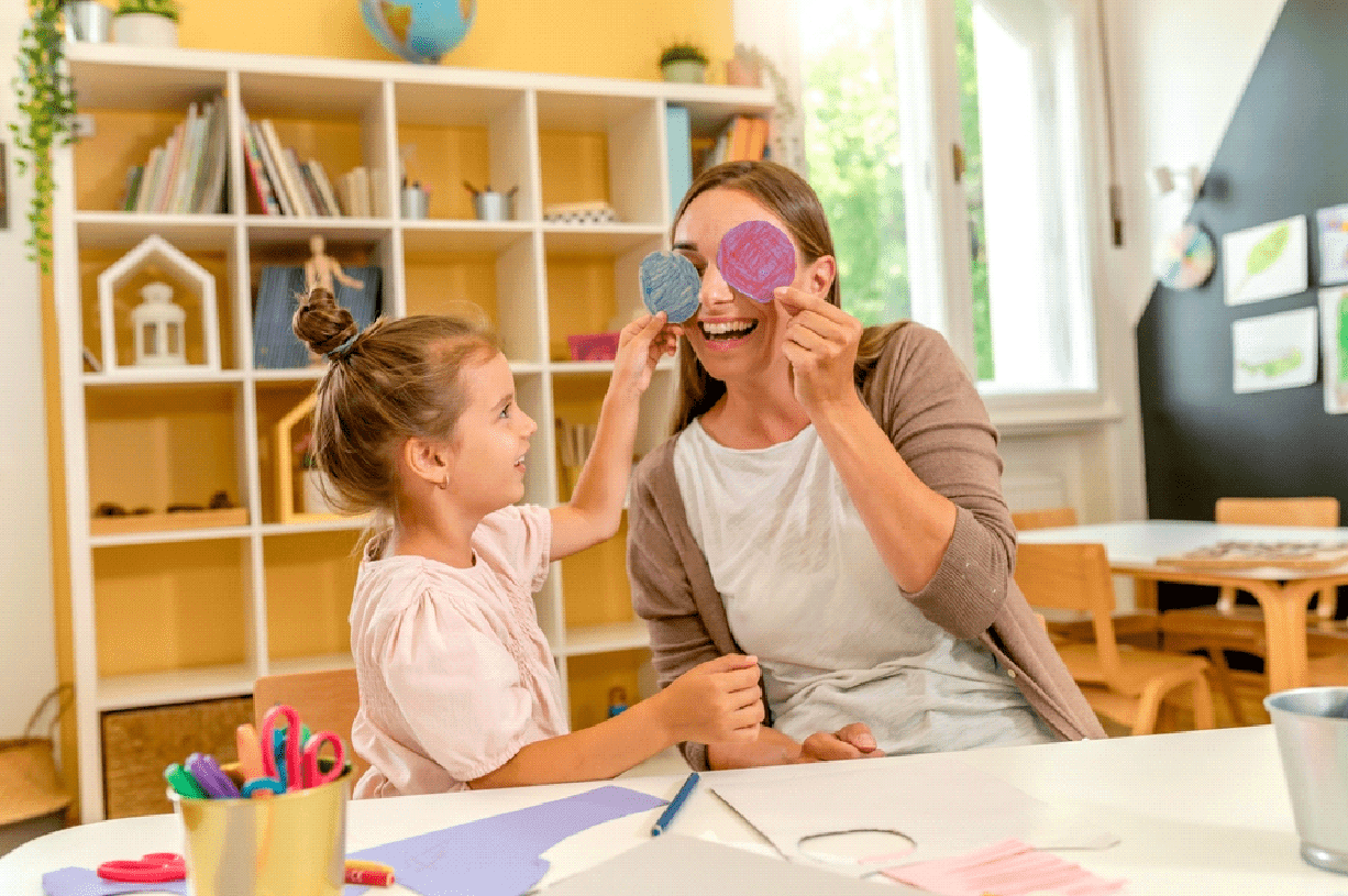 Girl on the lesson of the development of fine motor skills in kindergarten