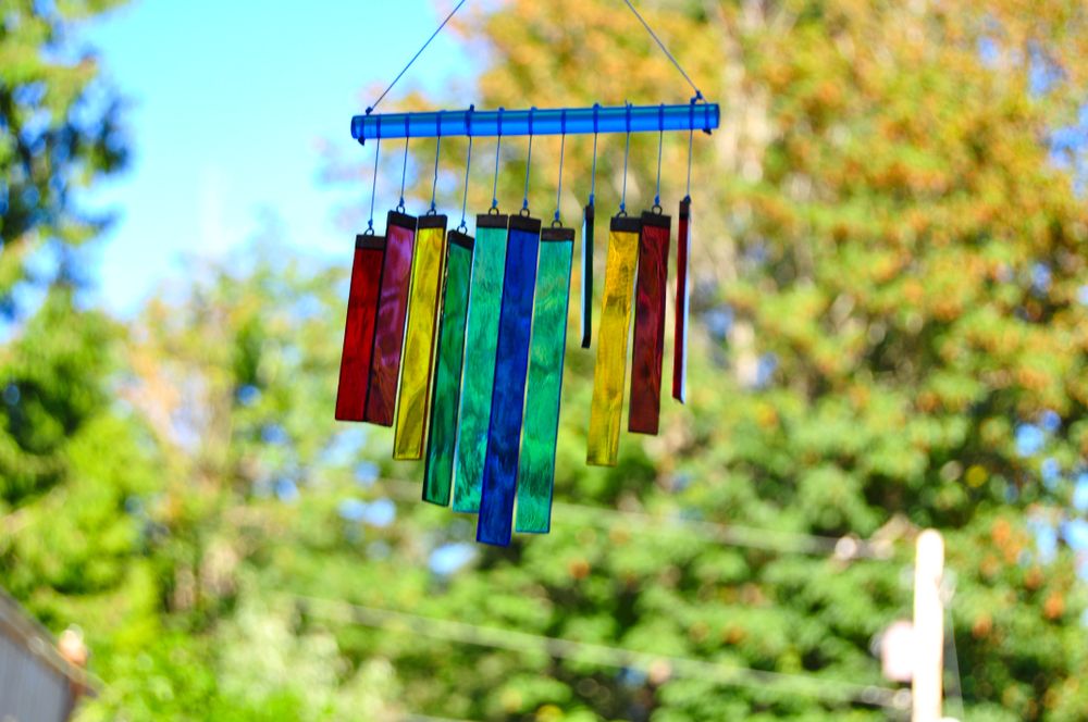 Wind chimes in rainbow color, in fall, swinging with the wind