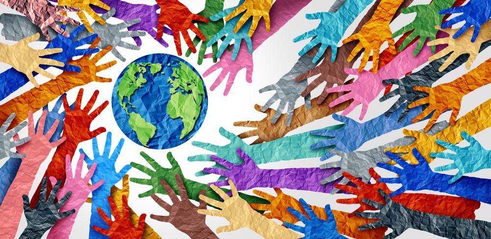 World diversity or earth day and international culture as a concept of diversity and crowd cooperation symbol as diverse hands holding together the planet earth.