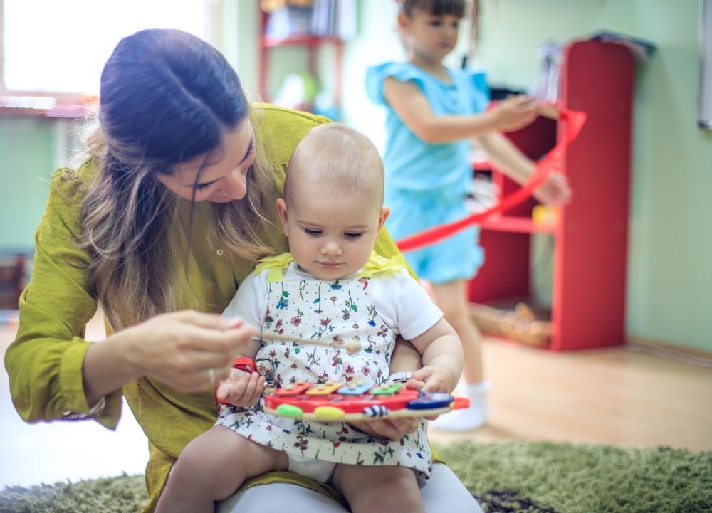 Something new for her. Baby in music school.