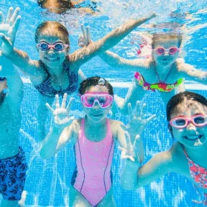 Children engaging in safe and fun water activities at DeeCyDa Daycare, splashing and playing in supervised outdoor water play areas.