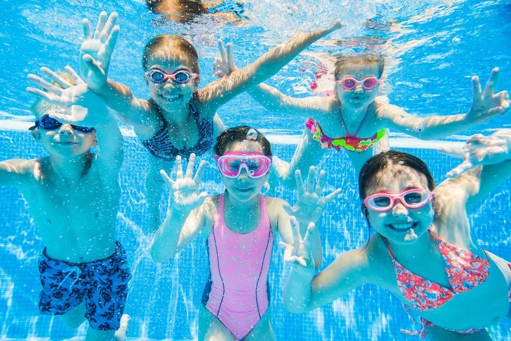 Children engaging in safe and fun water activities at DeeCyDa Daycare, splashing and playing in supervised outdoor water play areas.