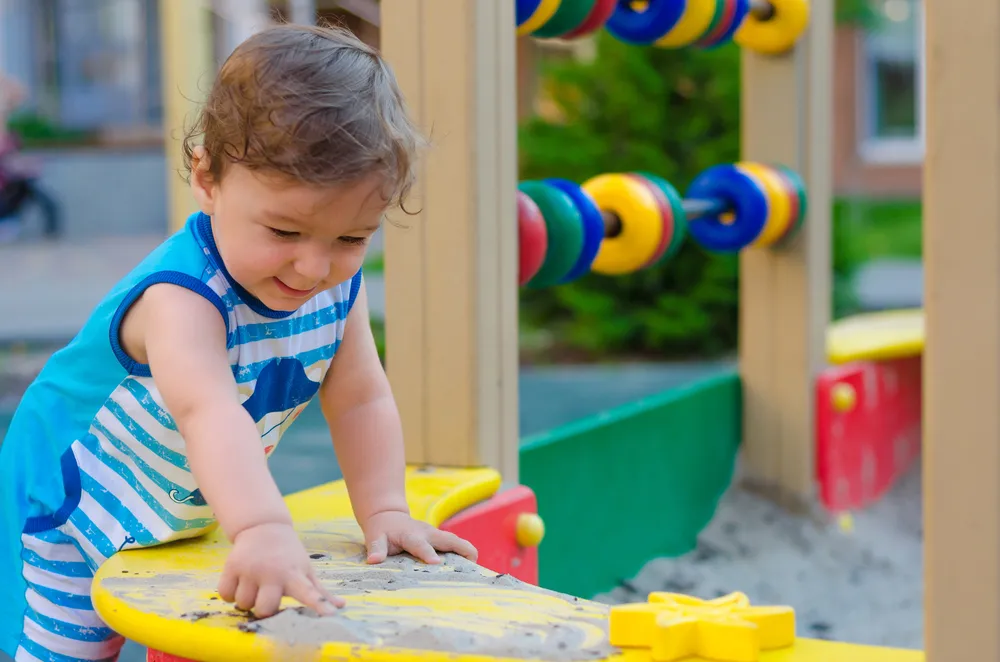 Toddler Development Program in Irvine: A Complete Guide for Parents 4 Toddler practicing physical development and coordination during safe outdoor play at DeeCyDa in Irvine